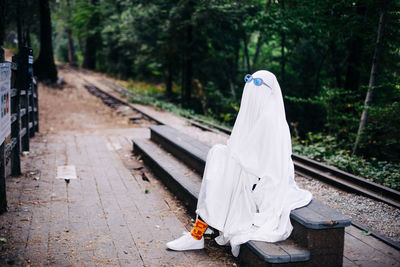 Rear view of person on railroad track