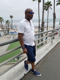 Full length of young man standing on beach