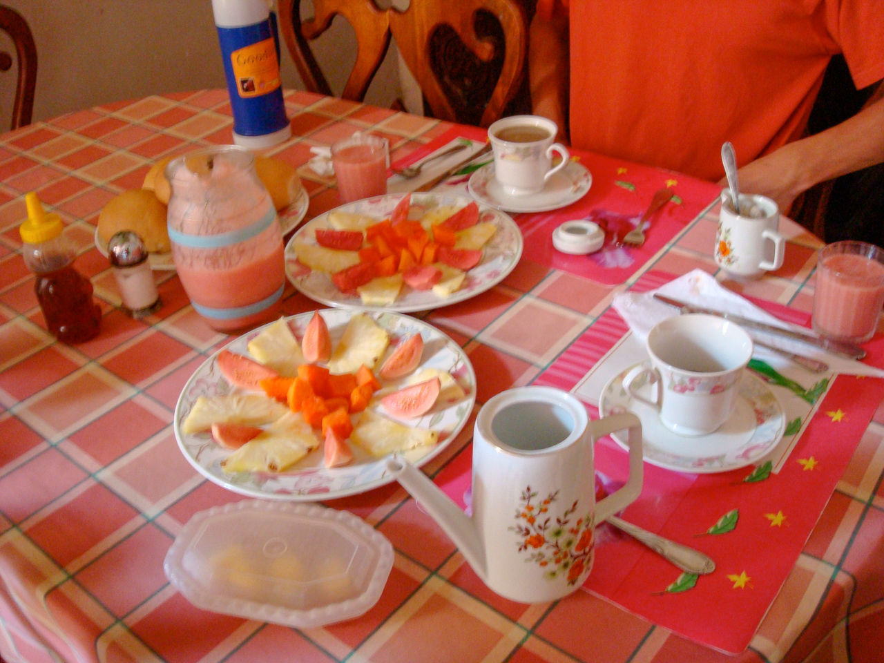 HIGH ANGLE VIEW OF BREAKFAST SERVED ON TABLE WITH PEOPLE