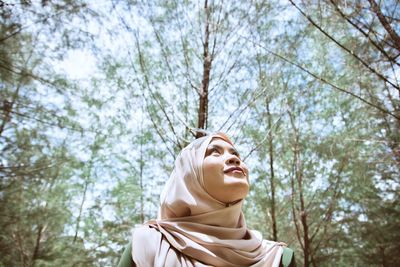 Low angle view of statue against trees