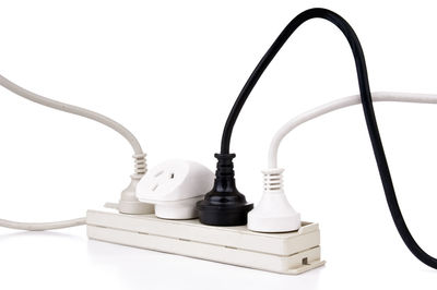 Close-up of electric lamp against white background