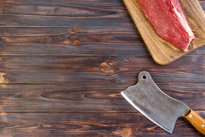 High angle view of leather on wooden table