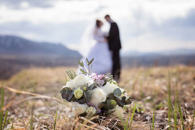 Bouquet with couple in background