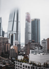 Modern buildings in city against sky