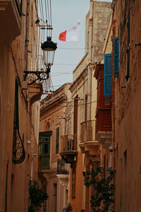 Low angle view of building with malta's flag