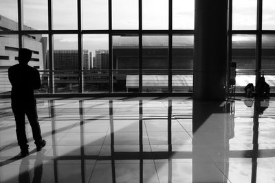 Man standing by window