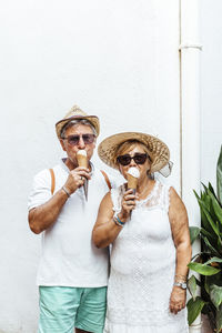 Senior tourist couple eating an ice cream