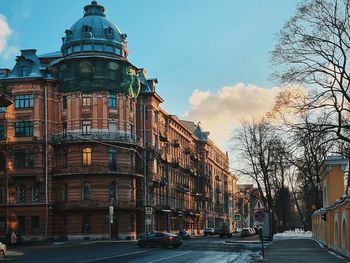 Street amidst buildings in city against sky