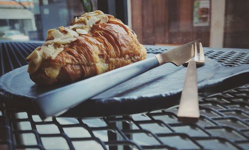 Close-up of bread in plate on table