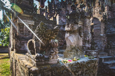 Statue against historic building