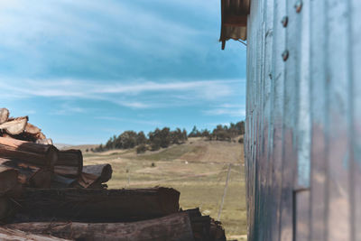 Stacks of firewood. preparation of firewood for the winter. background landscape of the andes