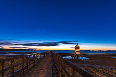 Scenic view of beach against blue sky