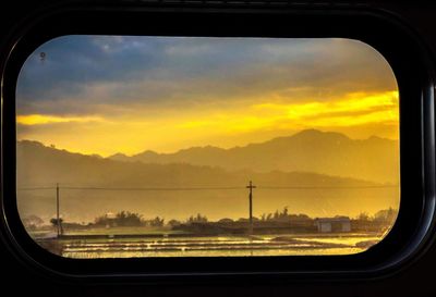 Scenic view of landscape seen through train window