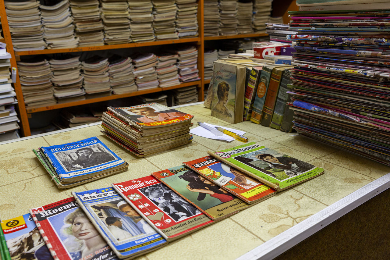 STACK OF BOOKS IN LIBRARY