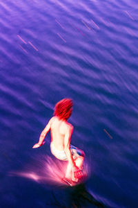 High angle view of woman swimming in pool