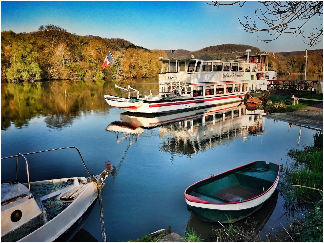 reflection, nautical vessel, water, moored, transportation, mode of transport, boat, lake, no people, tree, day, outdoors, nature, sky, gondola - traditional boat