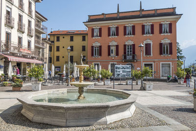 The main square of menaggio with houses with colored facades