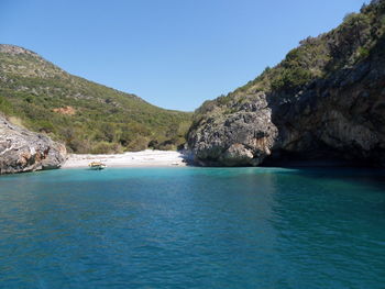 Scenic view of sea against clear blue sky