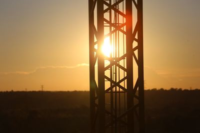 Silhouette landscape against sky during sunset