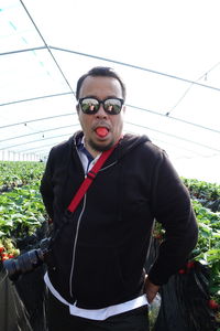 Portrait of young man standing outdoors