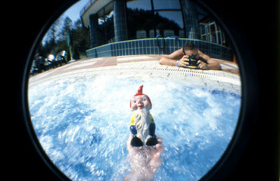 Portrait of young woman in water