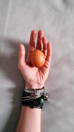 Close-up of hand holding eggs