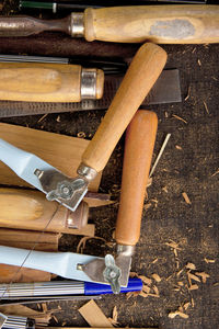 Close-up of work tools on wood