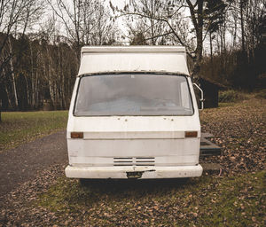 Abandoned car on field