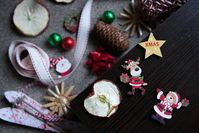 High angle view of christmas decoration and fruit on table