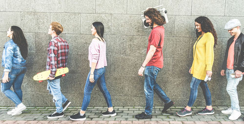 Friends walking on footpath