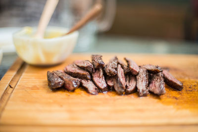 Close-up of meat on cutting board