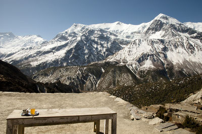 Scenic view of snowcapped mountains against clear sky