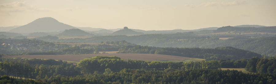 Scenic view of landscape and mountains against sky