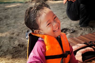 Portrait of happy girl on land