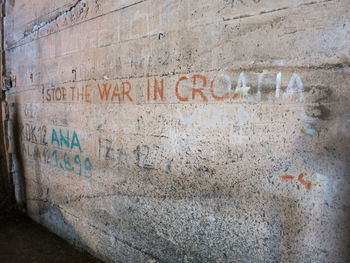 Close-up of text on wall