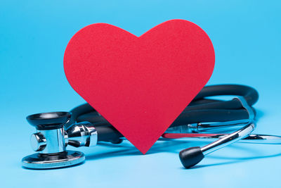 Close-up of heart shape against blue background