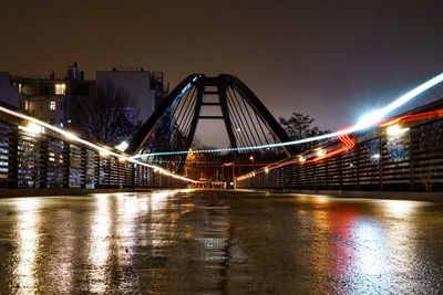 Illuminated suspension bridge at night