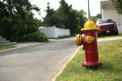 Fire hydrant on road against sky