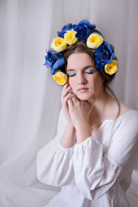 Beautiful ukrainian woman with a flower wreath