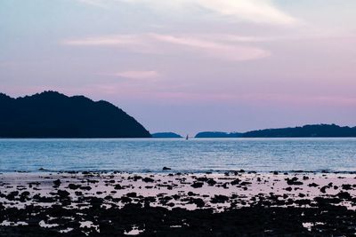 Scenic view of sea against sky at sunset