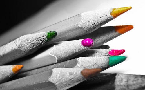 Close-up of multi colored pencils on table