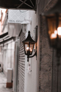 Close-up of illuminated lantern on wall