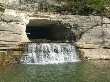 Scenic view of water flowing through rocks