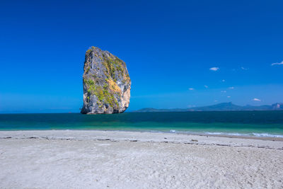 Scenic view of sea against blue sky