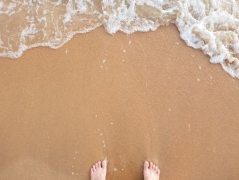 High angle view of wet sand on beach