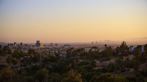 High angle view of buildings against sky during sunset