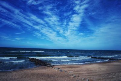 Scenic view of sea against blue sky