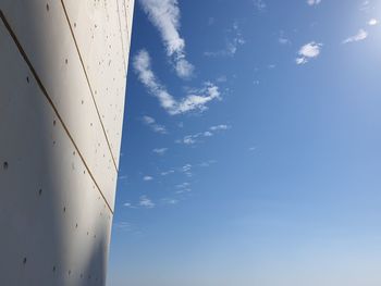Low angle view of airplane flying against sky
