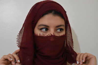 Portrait of woman covering face