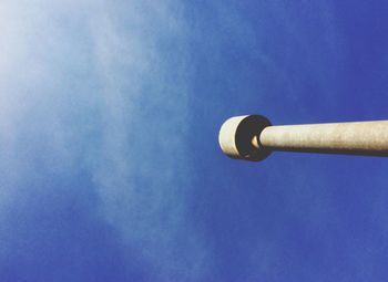 Low angle view of lamp post against blue sky